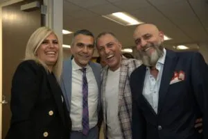 Four guests posing together at the Etehad Law office opening