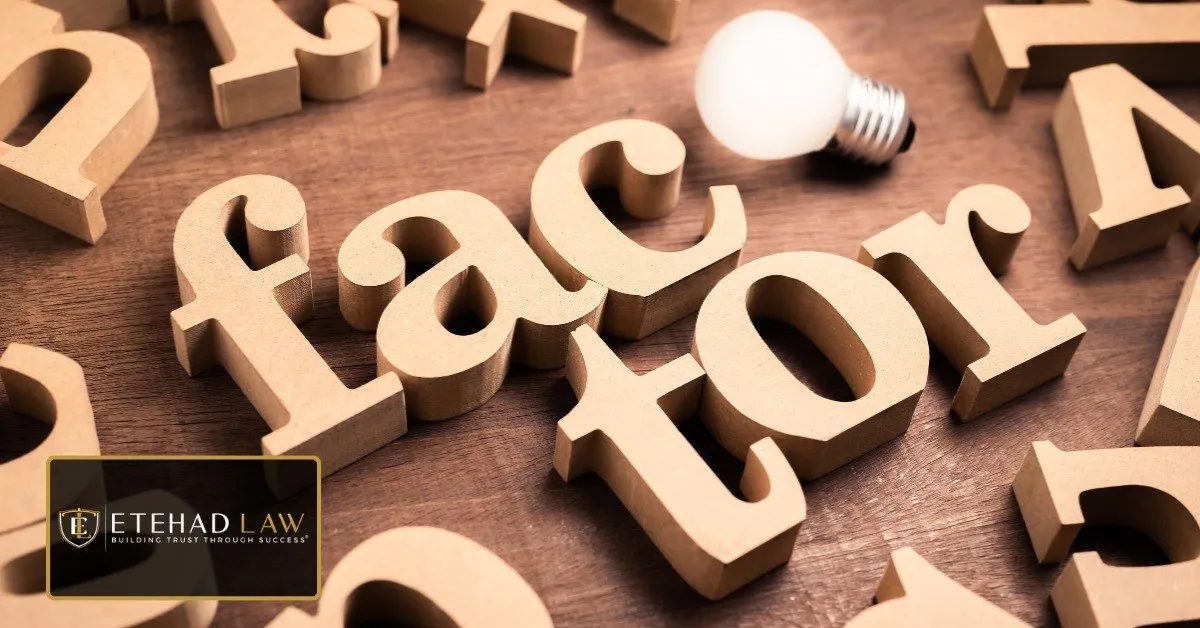 Wooden letter blocks spelling the word factor beside a light bulb, representing the factors that influence a California car accident settlement amount