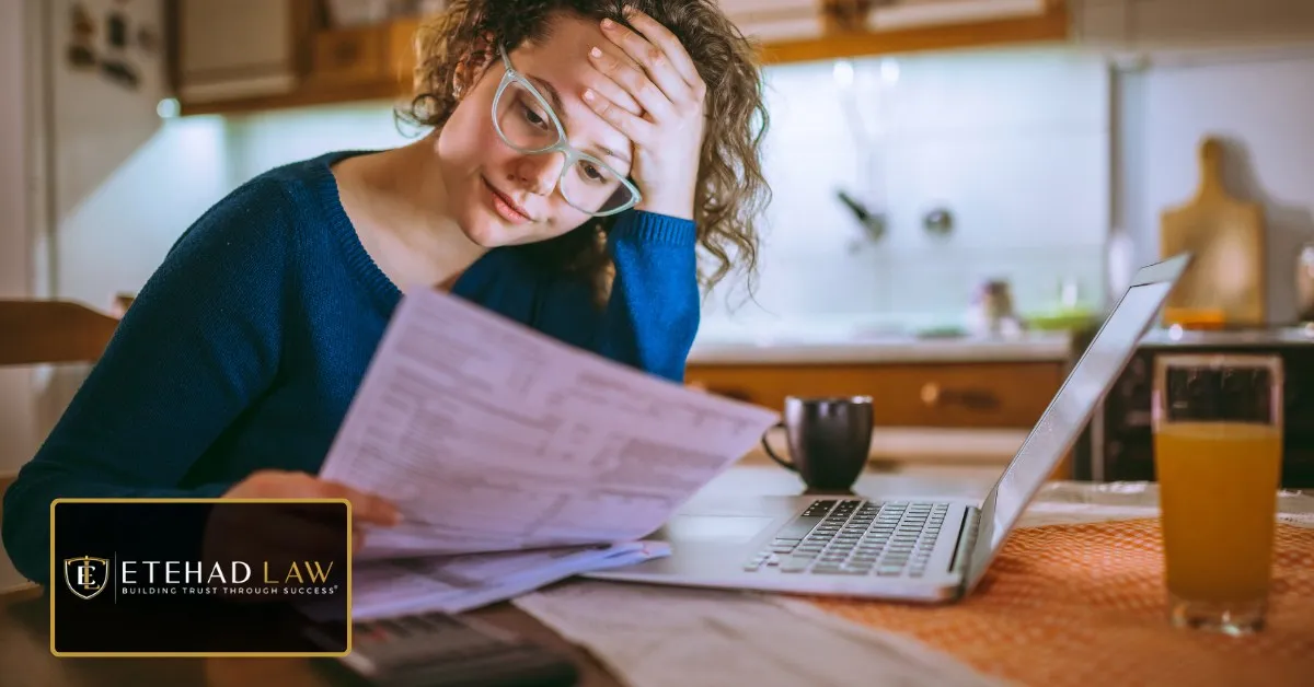 Woman reviewing a stack of medical bills after an accident