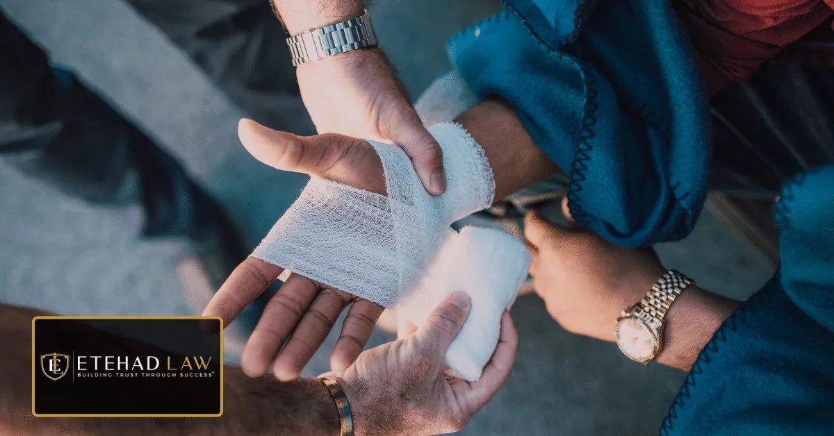 Person bandaging an injured wrist, representing whether hiring a personal injury lawyer is worth the cost