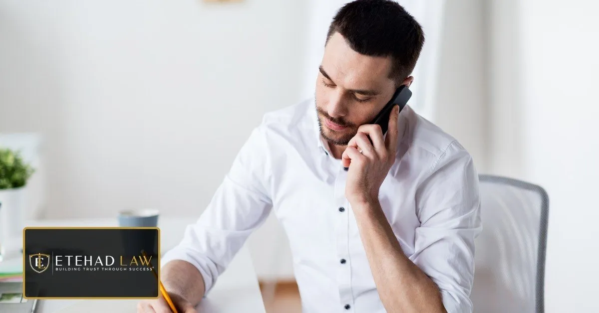 Homeowner taking notes during a phone call while preparing a complaint to the California Contractors State License Board