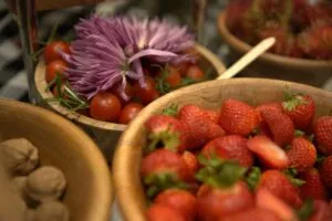 Close-up of a fruit and flower spread served at the opening