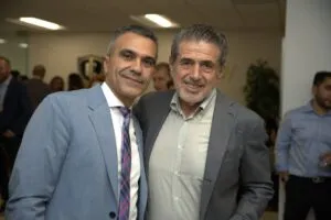 Two guests posing side by side at the reception