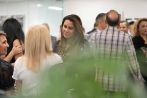 Guests mingling and talking at the Etehad Law grand opening