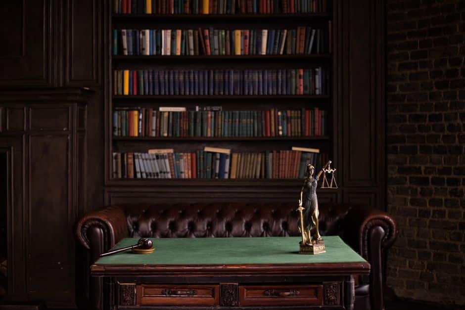 Law library with scales of justice representing California car accident law